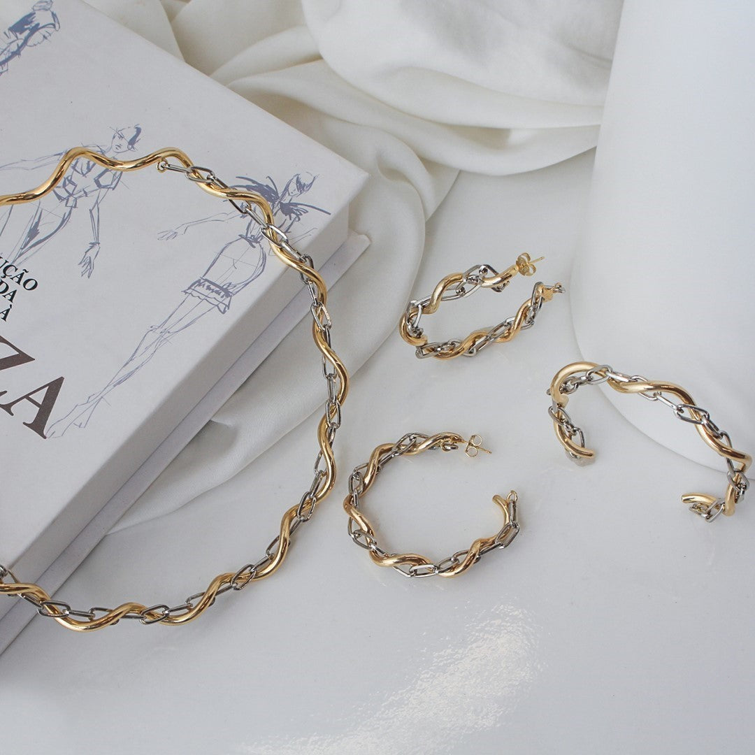 Brinco de Argola Torcido Elos Hanna Folheado a Ouro e Ródio Branco