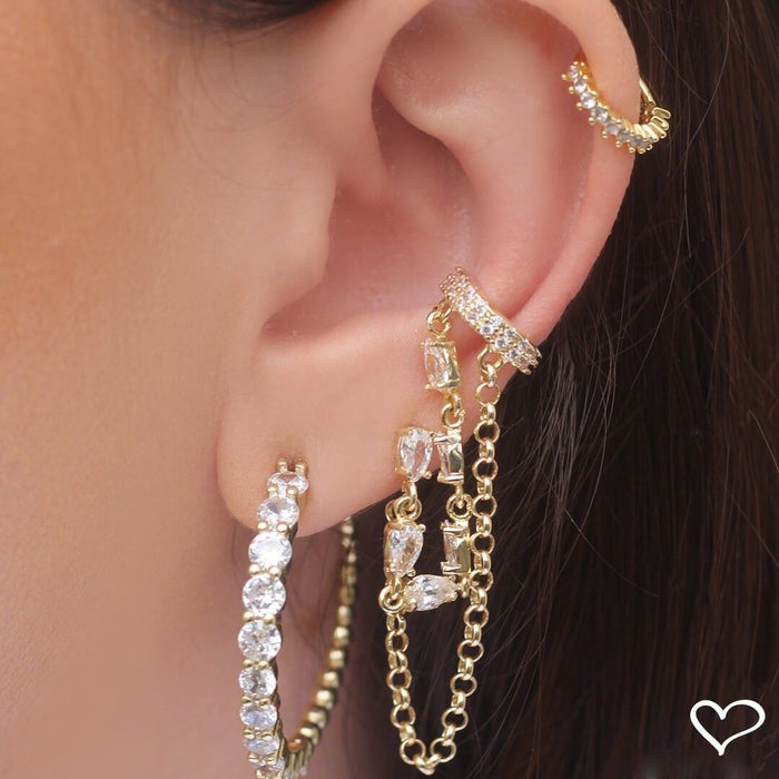 Piercing de Furo Piuka Jenna Argola Torção 8mm Zircônias Dourado